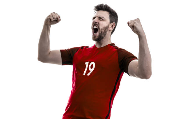 istock Fan / Sport Player on red uniform celebrating on white background 940092100