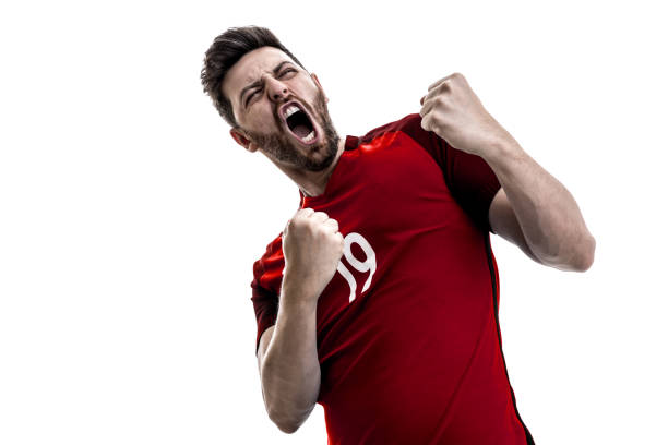 istock Fan / Sport Player on red uniform celebrating on white background 940092112