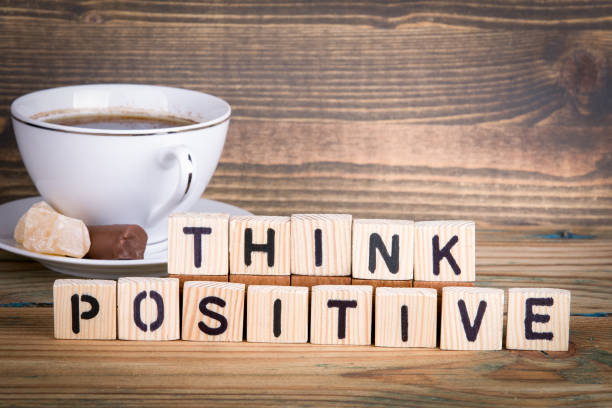 istock think positive. Wooden letters on the office desk, informative and communication background 940096466