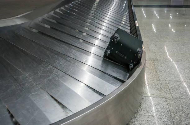 istock Suitcase with wheels black rolls on the Luggage 940104000