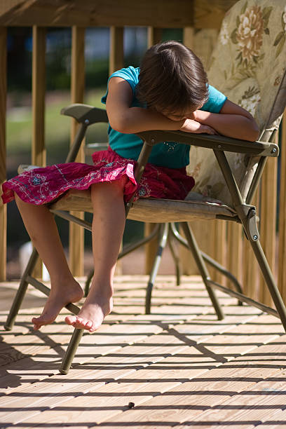 istock little girl sitting on the seat 94010591