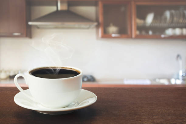 istock Hot coffee on tabletop in modern kitchen. Close up. 940107880