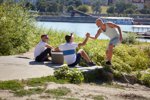 Young man having a celebration with friends outdoors