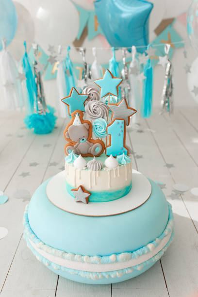 istock First birthday cake with white and blue decor 940114668