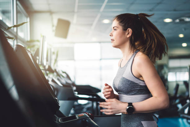 istock Woman running on a treadmill 940118698
