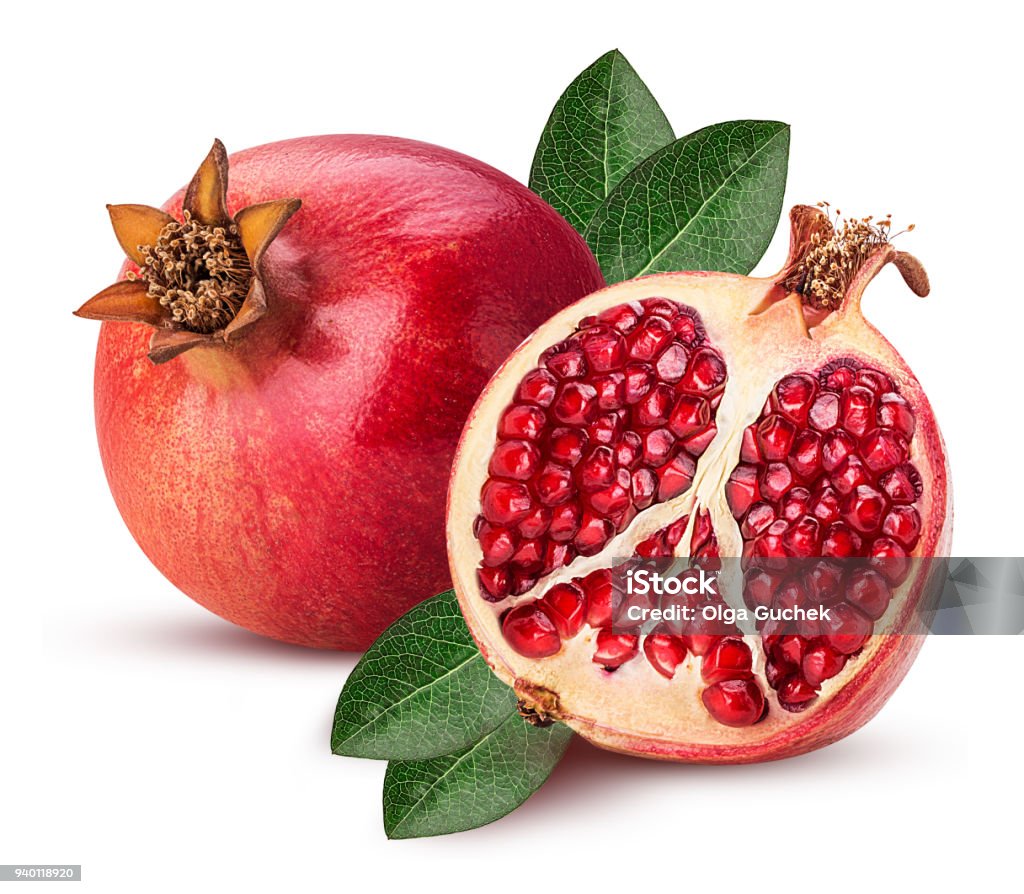 Ripe pomegranate fruit and one cut in half with leaf Ripe pomegranate fruit and one cut in half with leaf isolated on white background. Clipping Path. Full depth of field. Pomegranate Stock Photo