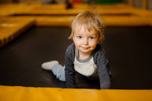 istock Cute little smiling boy crawling on the floor 940119096
