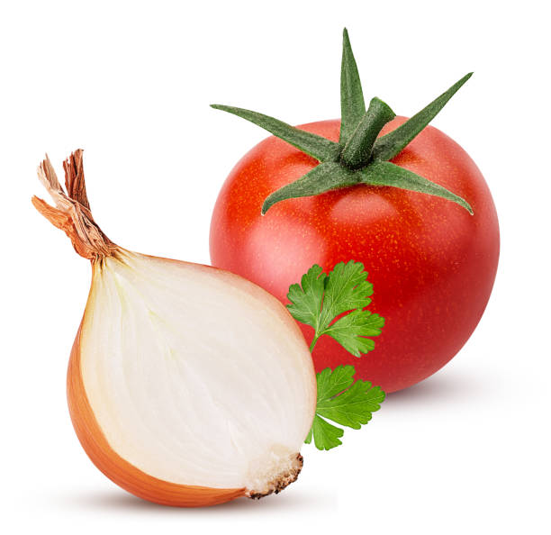 yellow onion cut in half, red tomato, green parsley