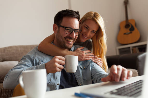 istock Happy couple relaxed at home 940122936