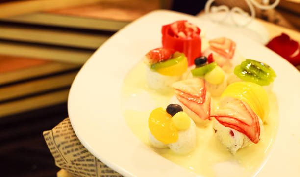 istock thai dessert: tropical mixed fruit coconut milk jelly on white dish 940128236