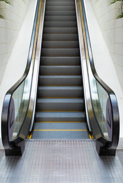 istock Modern escalator in shopping mall, Department store escalator 940128868