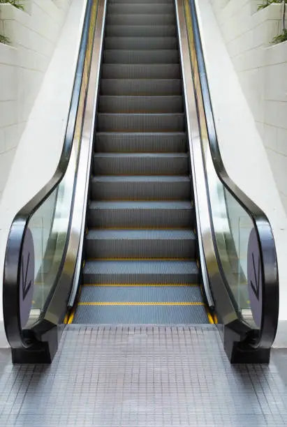 Photo of Modern escalator in shopping mall, Department store escalator