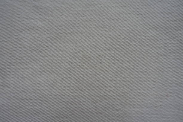istock Texture of white jeans fabric from above 940133490