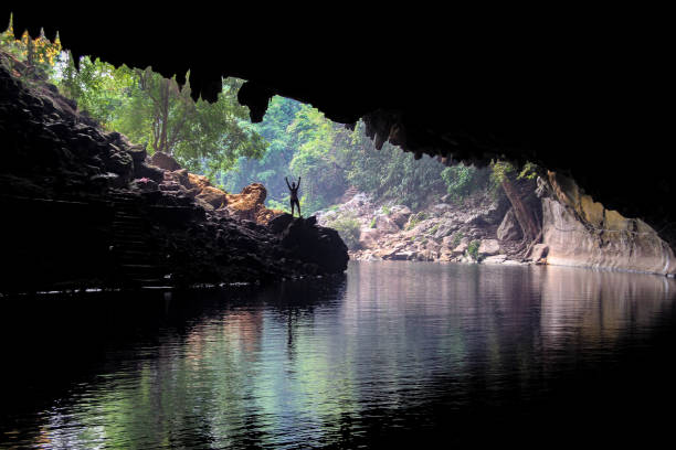 istock People in nature, Tham Kong Lo Cave in Laos 940135184