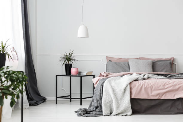 istock Grey and pink bedroom interior 940142924