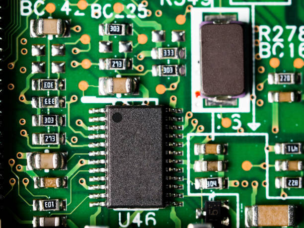 istock close-up of circuit board with integrated circuits, resistors and capacitors. 940143498