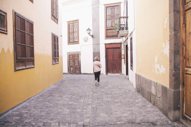 istock Young tourist walking down street 940143710
