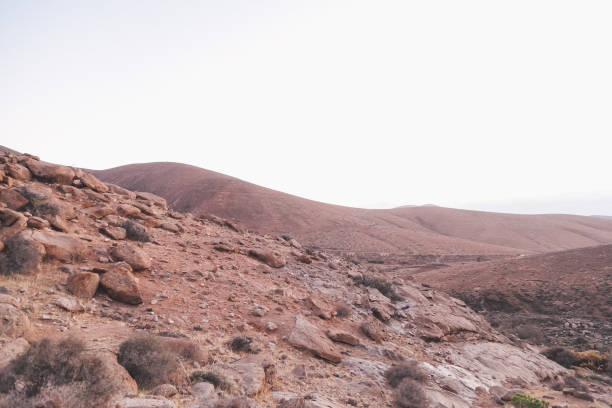 istock Winding road toward the mountains 940147424