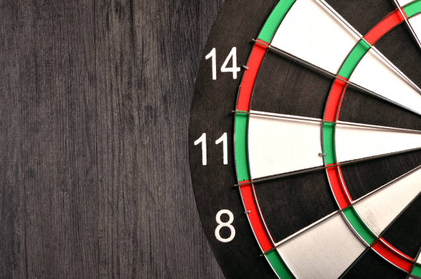 istock Dartboard on a wooden background 940147480