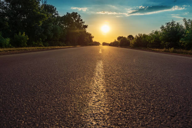 istock road with line closeup in sunset 940150756