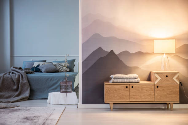 istock Table lamp on wooden cabinet 940153128