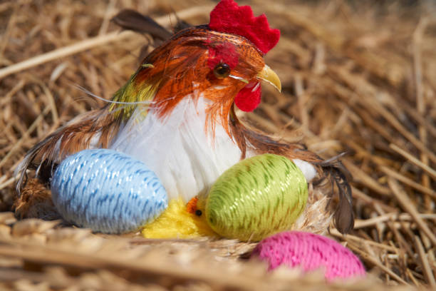 istock Easter chick decoration in a nest and colorful easter eggs 940153576