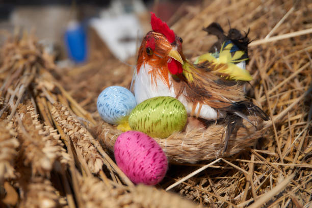 istock Easter chick decoration in a nest and colorful easter eggs 940153582