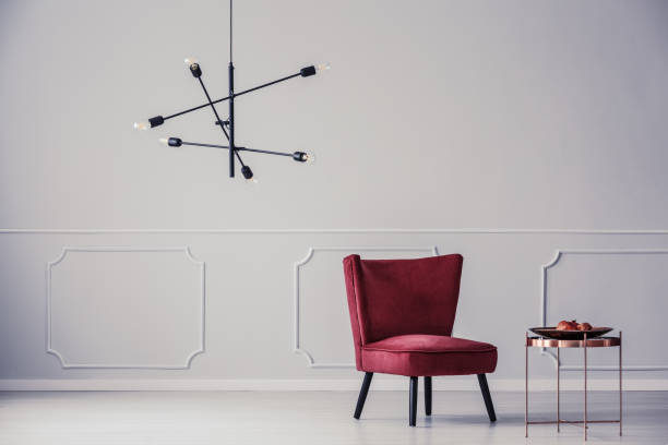 istock Red armchair in white apartment 940154070