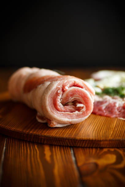 istock Roll of meat with various spices and herbs 940154176