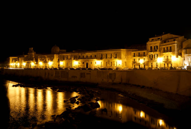 istock Ortygia Island's Coast by Night in Syracuse 940158330