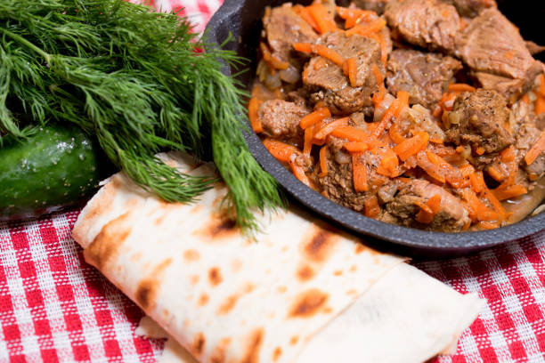 istock Beef stew in frying pan and vegetables 940159104