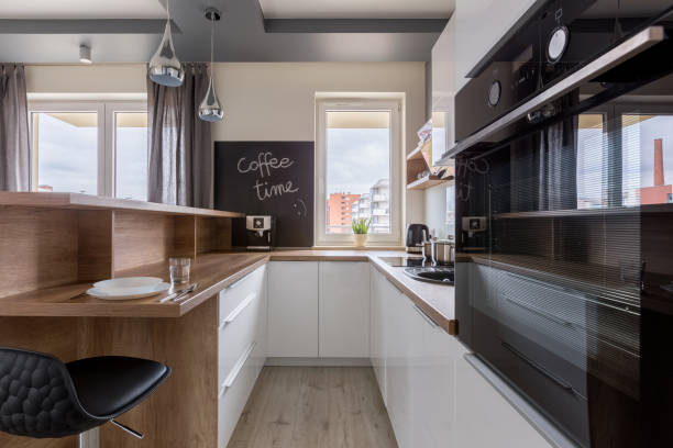 istock Contemporary kitchen with wooden cabinets 940162428