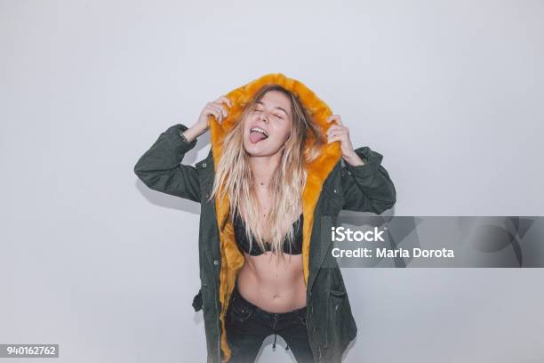 Excited Young Woman Dancing Stock Photo - Download Image Now - Sticking Out Tongue, One Woman Only, Women