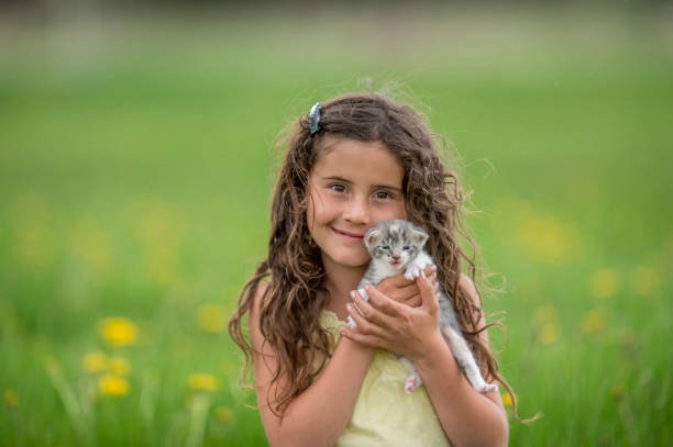 istock Girl Holding Her Pet 940166420