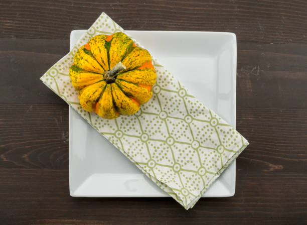 Acorn Squash Sits on Corner of Napkin and Plate