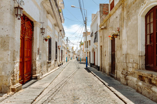 Colonial houses in an empty alley of the Yanahuara neighborhood in Arequipa (Peru) stock photo