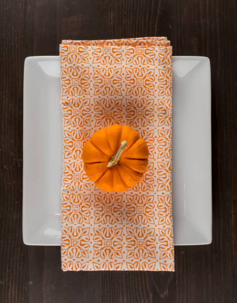istock Jack Be Little Pumpkin and Orange Napkin on Square Plate 940177676