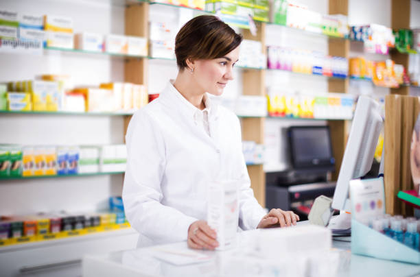 istock Pharmacist ready to assist in choosing at counter 940177800