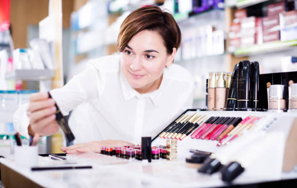 istock Customer browsing rows of cosmetic products 940177830