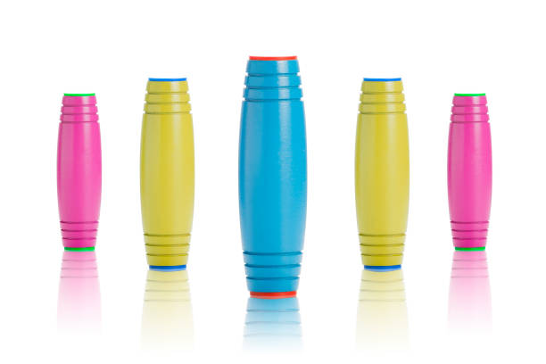 istock Fidget rolling Stick Toys for Anxiety Release - colorful group on white background 940181134