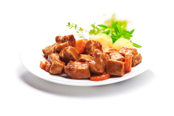 istock Goulash, beef stew with potatoes, isolated on white background 940182882