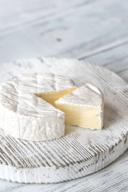 Camembert cheese on the wooden board