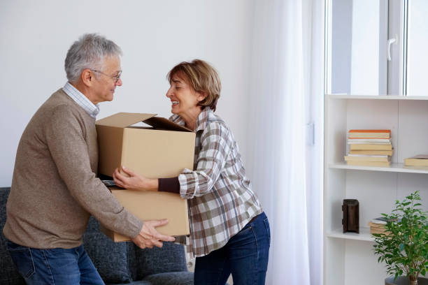 istock Senior couple moving into a new apartment 940189358