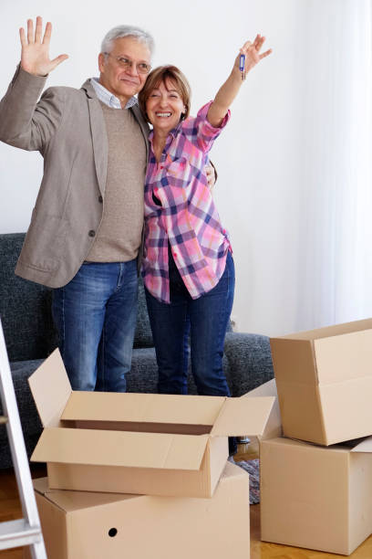 istock Senior couple moving into a new apartment 940192354