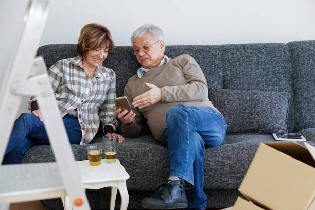 istock Senior couple moving into a new apartment 940192622