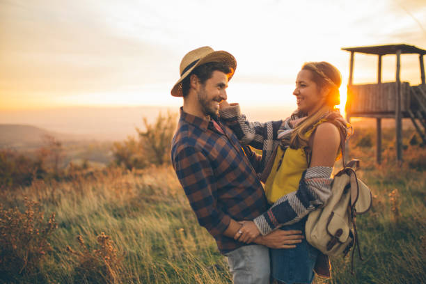 istock Young couple enjoying in nature 940193512