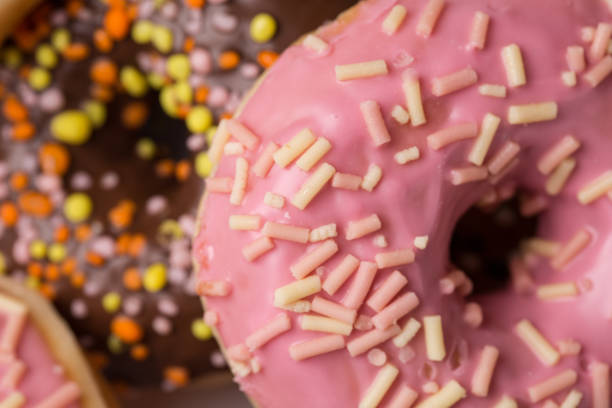istock homemade donuts with chocolate and icing glaze on white background 940202520