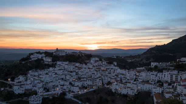 Casares Village at sunset A wide angle shot of Casares village in Spain taken at sunset on a sunny day in March. casares photos stock pictures, royalty-free photos & images