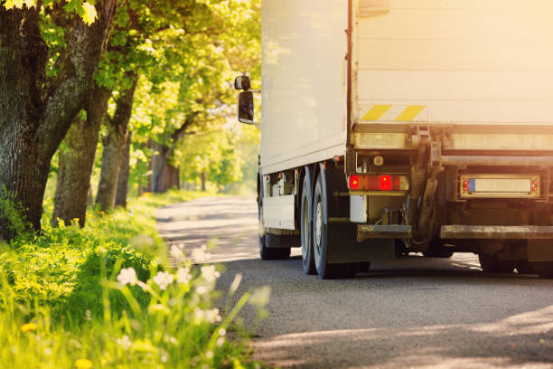 istock Truck moving on alley in summer 940207654
