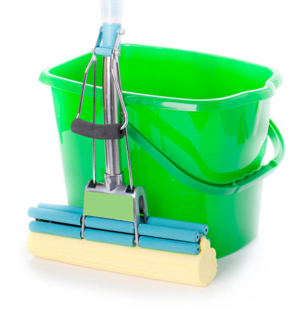 istock Green bucket and mop 940212142